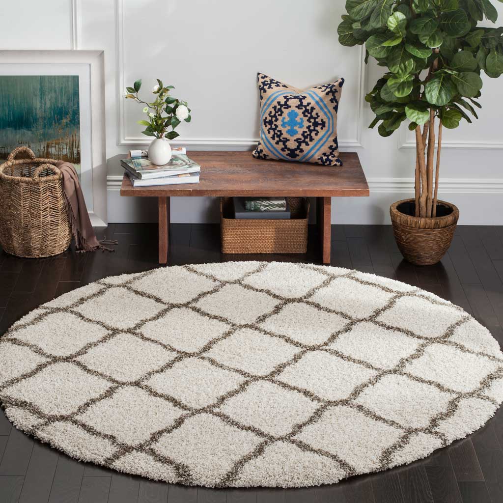 A plush ivory rug with gray rounded diamonds adds comfort and quiet geometry