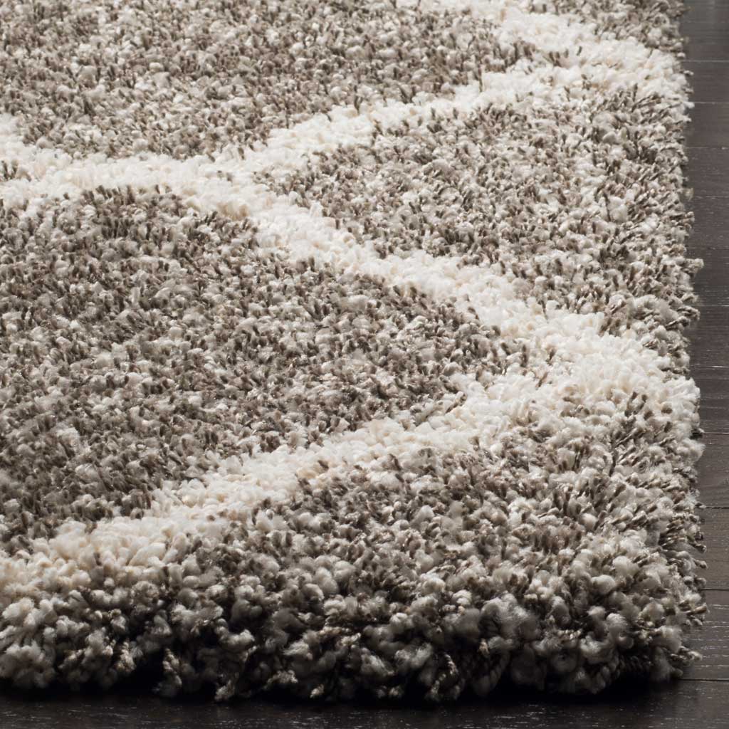 Thick gray fibers frame an ivory diagonal at the finished edge