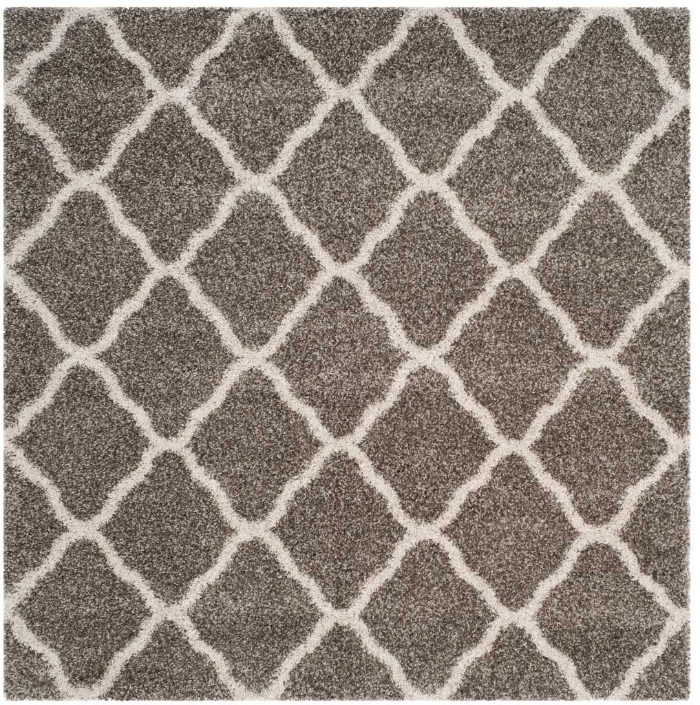 Square gray rug patterned with interlocking ivory curved diamonds