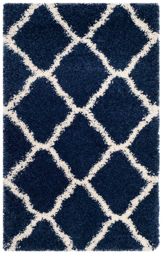 Navy accent rug patterned with broad ivory diamond lines