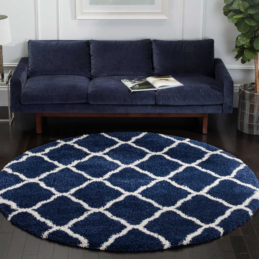 A navy-and-ivory diamond lattice gives this round shag rug crisp definition