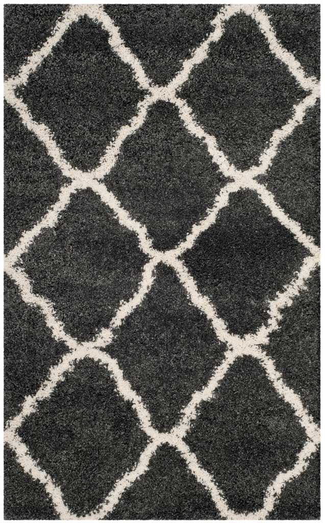 Small dark gray shag rug with bold ivory diamond outlines