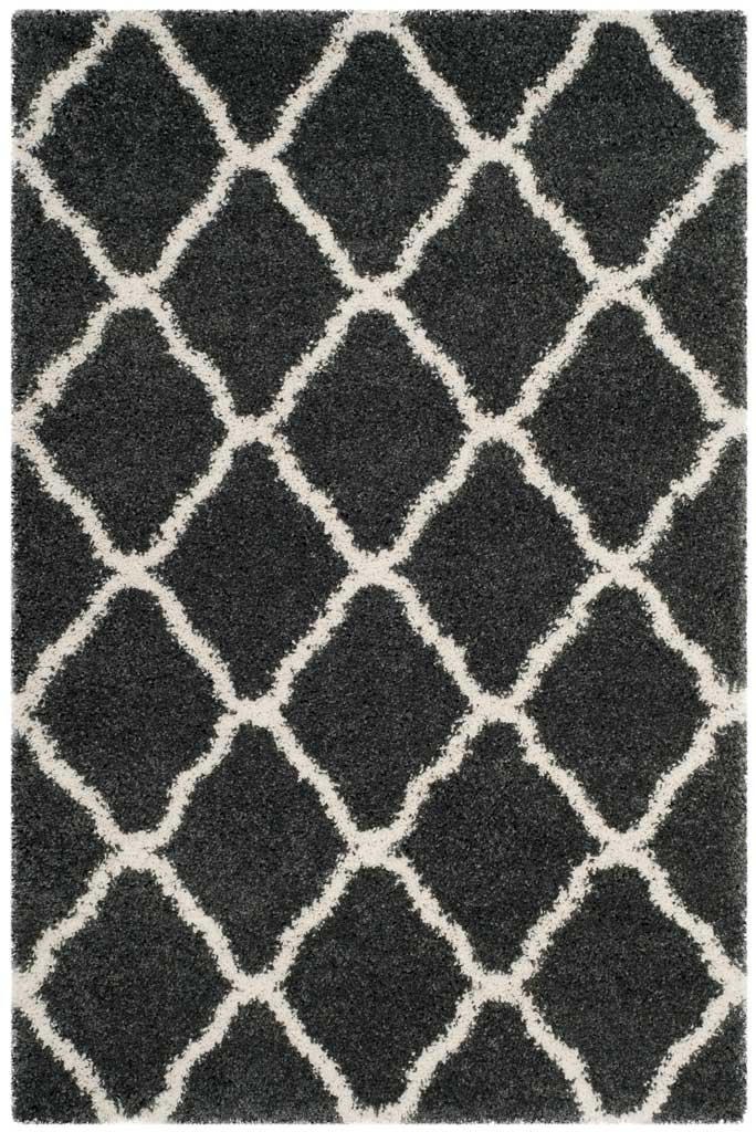 Charcoal rectangular rug patterned with broad ivory curved diamonds
