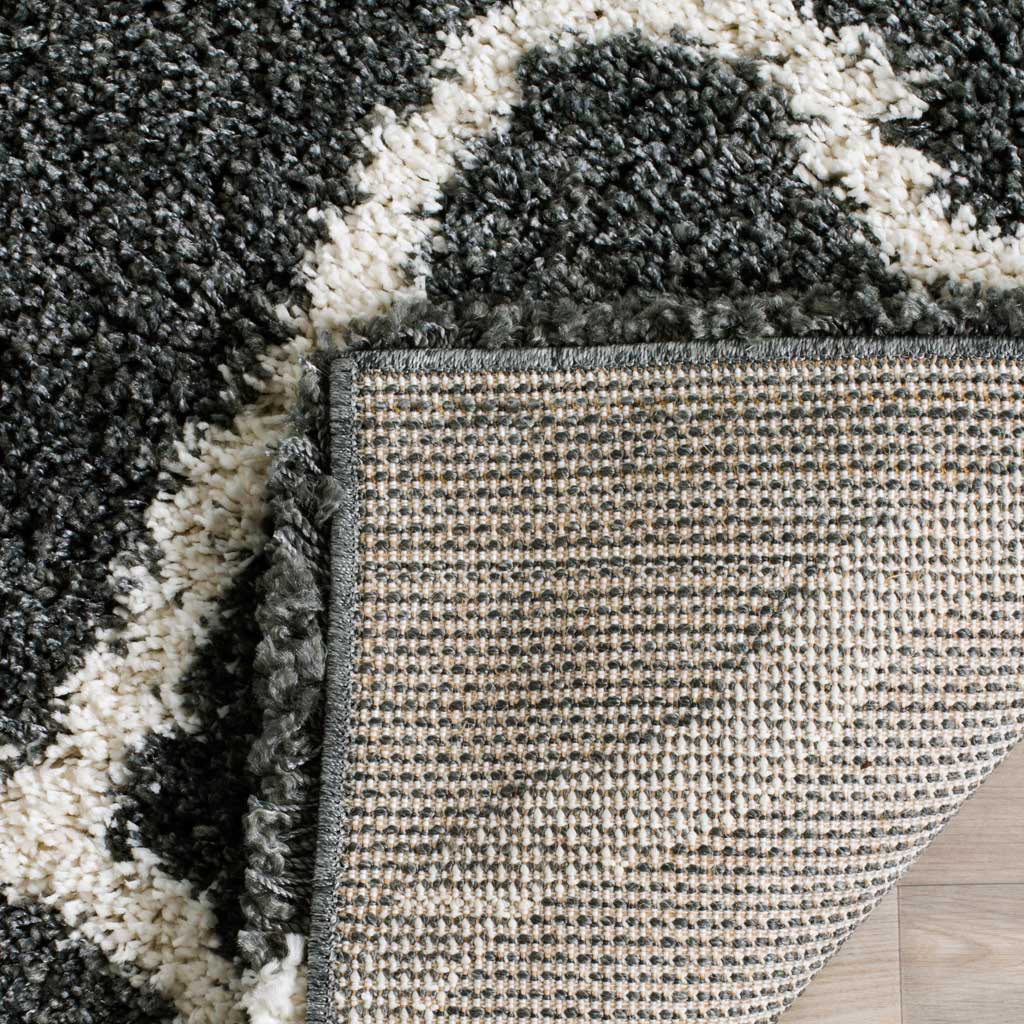 Woven underside and dark bound edge support the plush rug