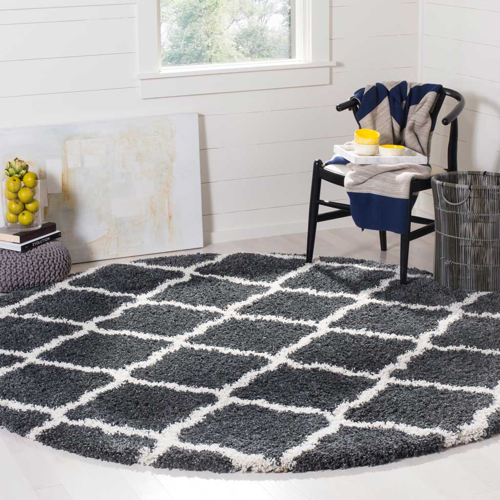 A plush dark gray surface and ivory rounded diamonds bring texture underfoot