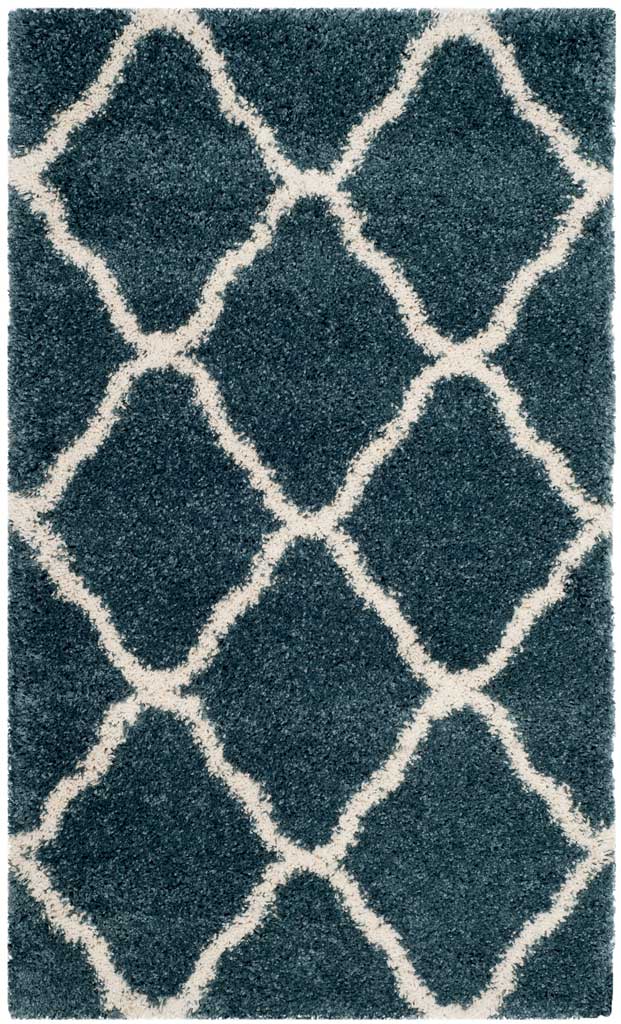 Small blue shag rug with generous ivory curved diamonds