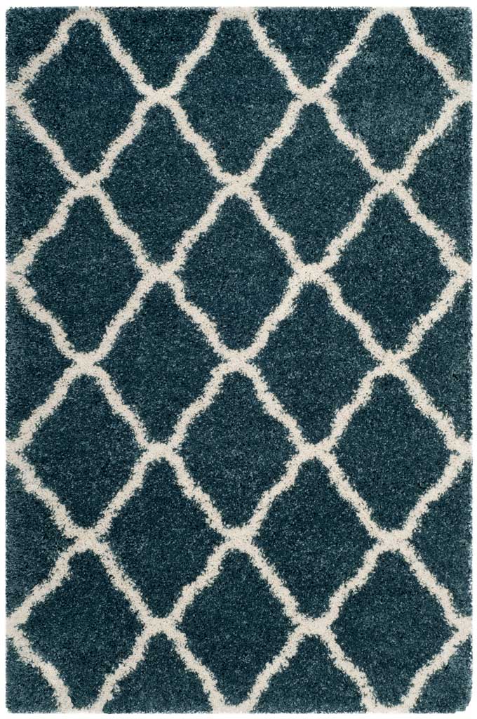 Slate blue rectangular rug with bold ivory diamond outlines