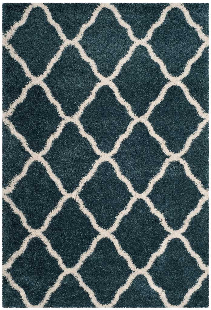 Ivory contours form rounded diamonds across deep blue shag