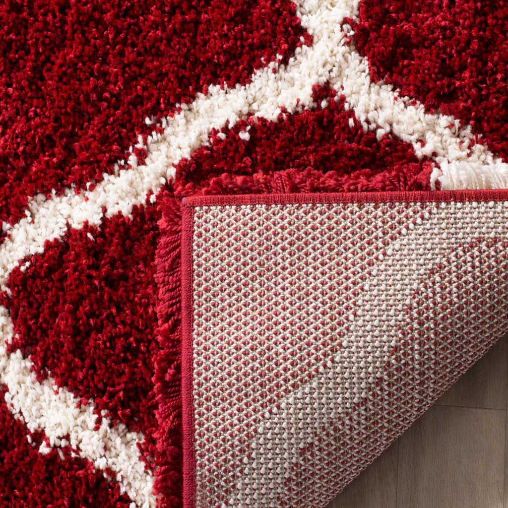 Woven underside and red binding support the patterned pile