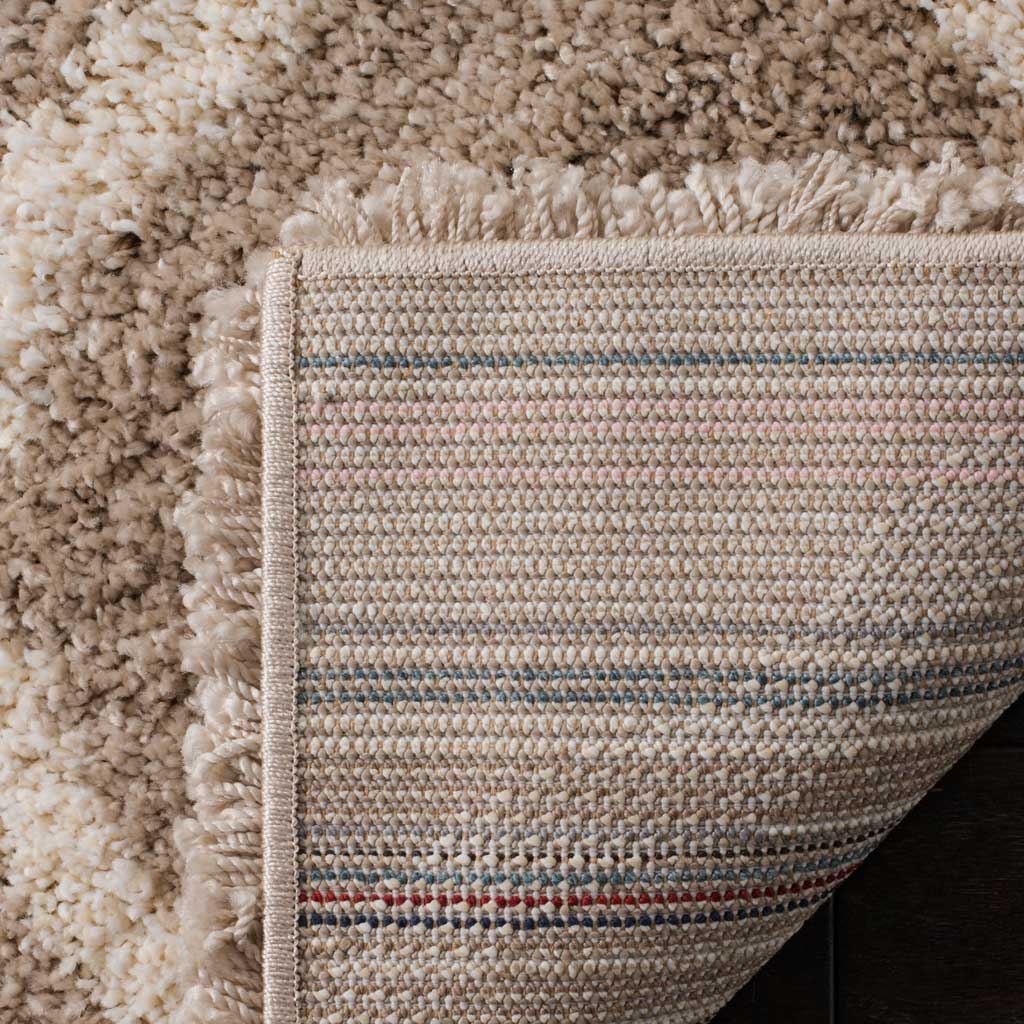 Woven striped backing supports the dense beige shag pile