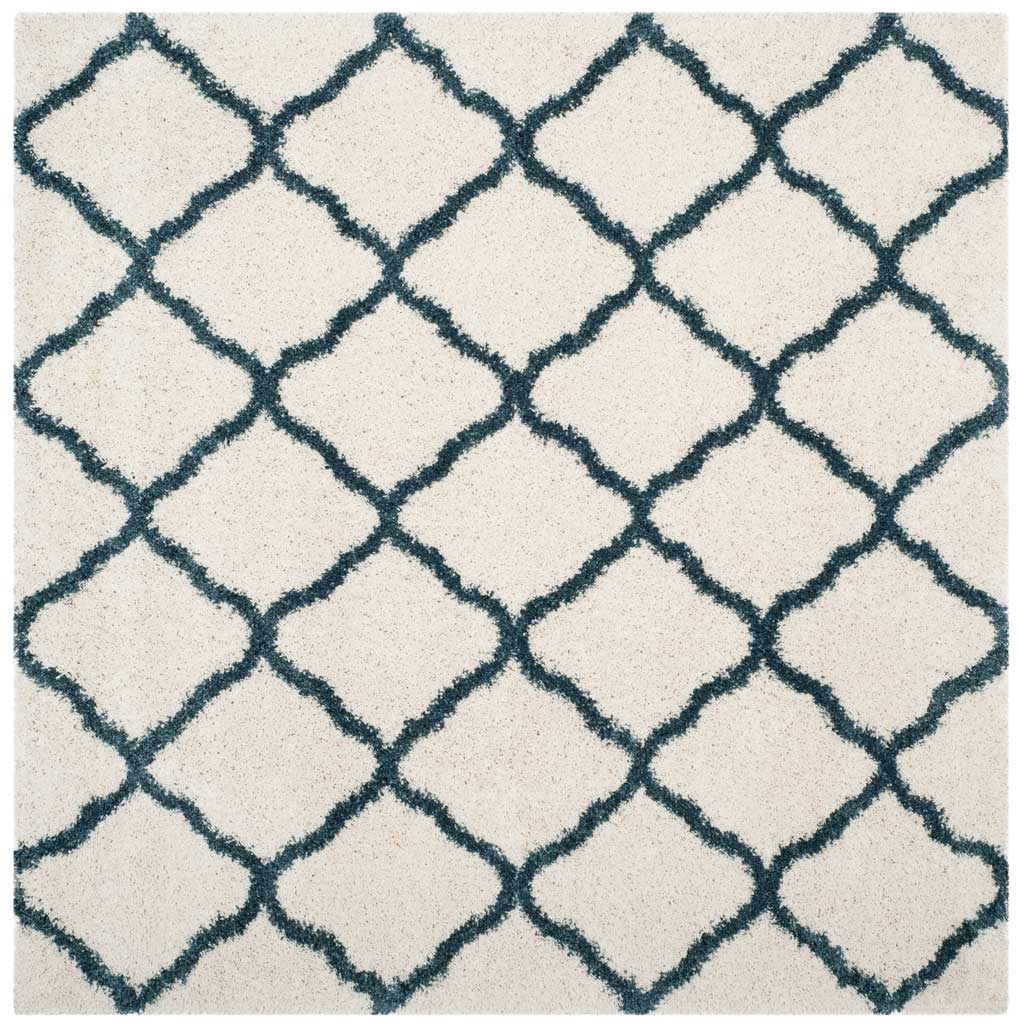 Square ivory rug patterned with interlocking blue curved diamonds
