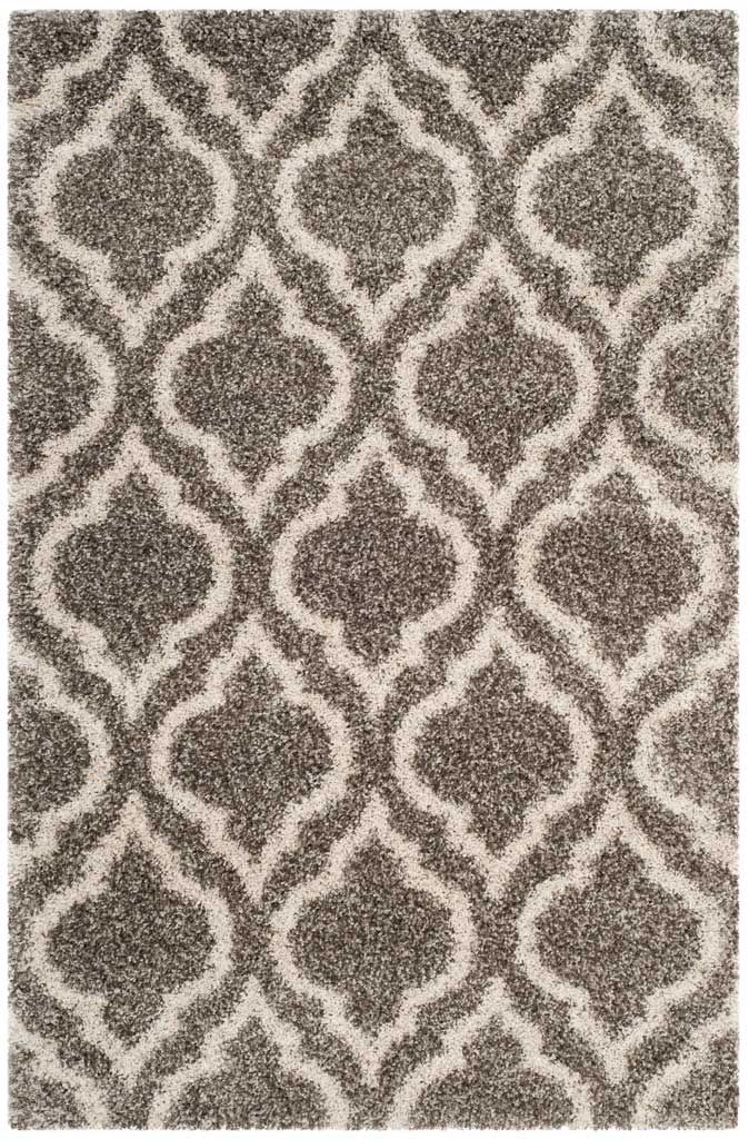 Gray rectangular shag rug with bold ivory ornamental outlines