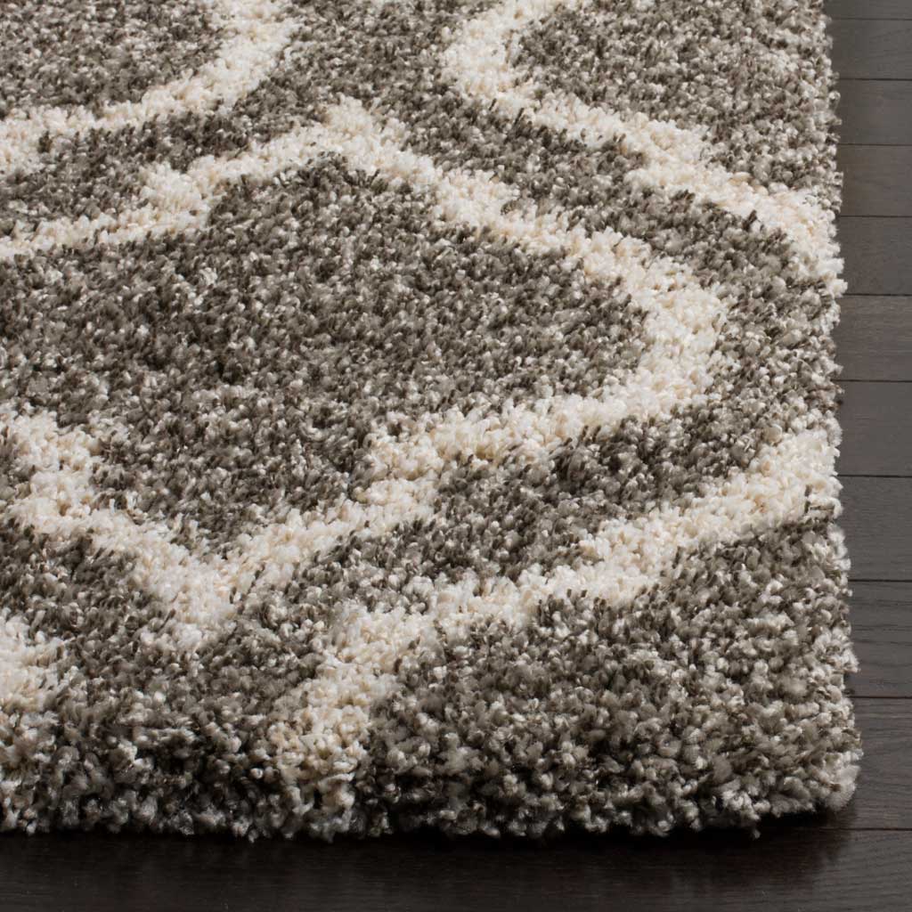 Thick gray shag meets ivory curved lines along a finished edge