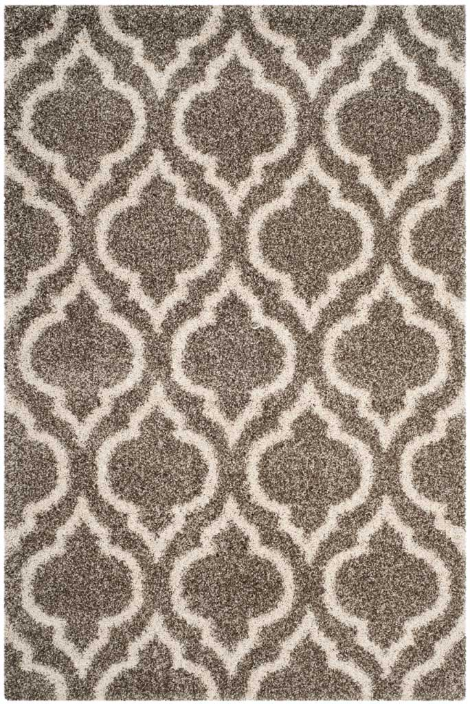 Plush gray pile framed by a repeating ivory arabesque pattern