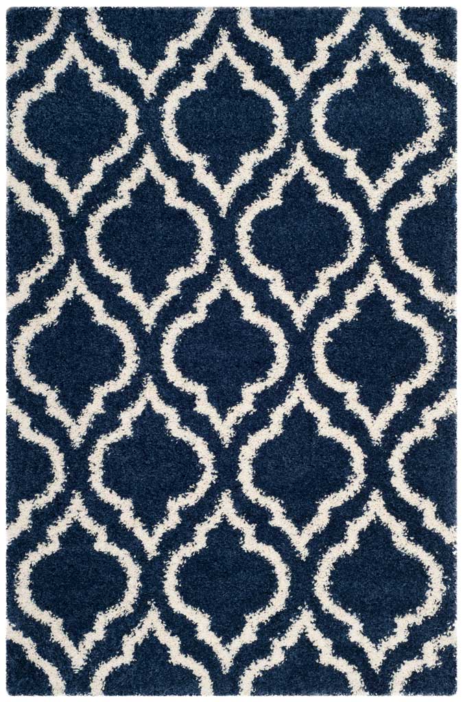 Navy rectangular rug with a bold ivory ornamental pattern