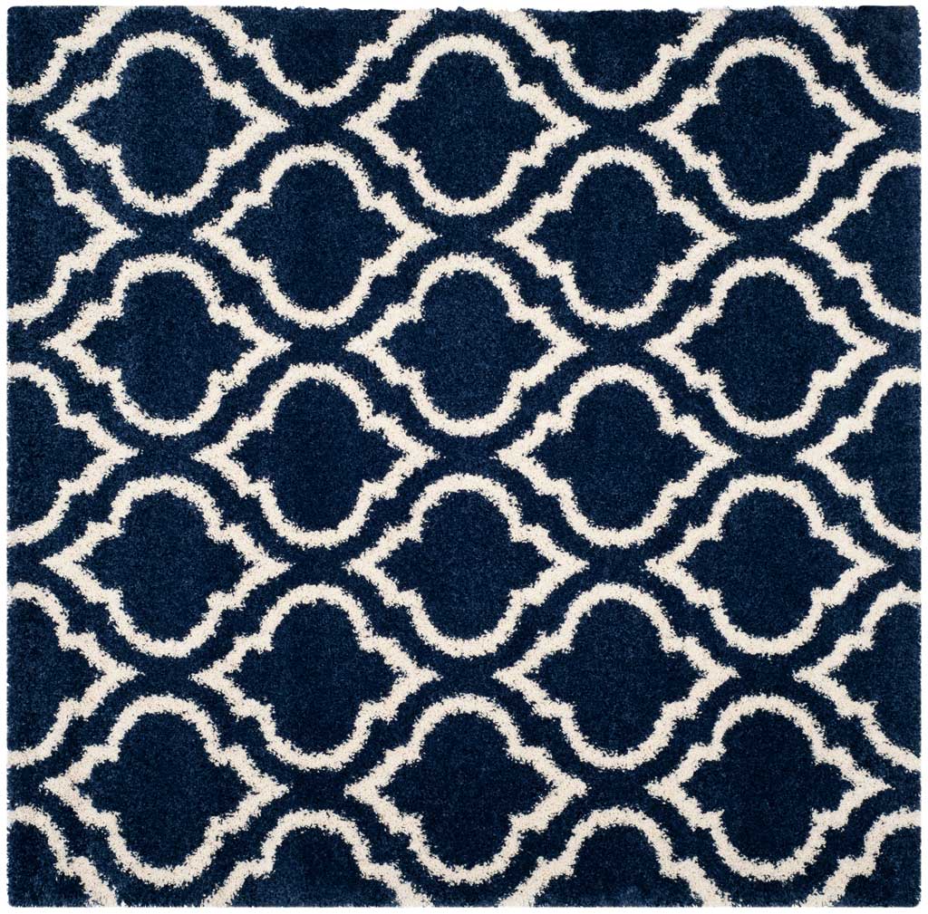 Square navy rug with interlocking ivory curved motifs