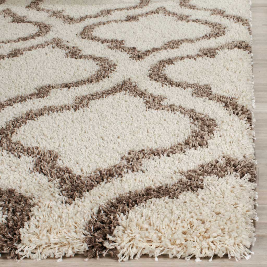 Plush ivory fibers frame beige curves along the rug's edge