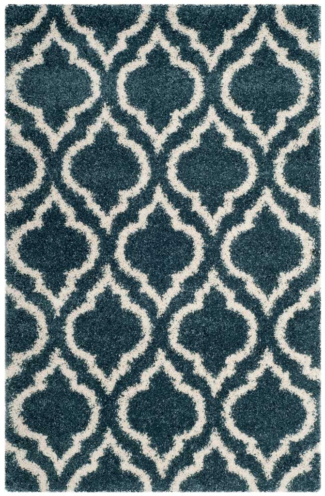 Blue rectangular shag rug with a sweeping ivory trellis