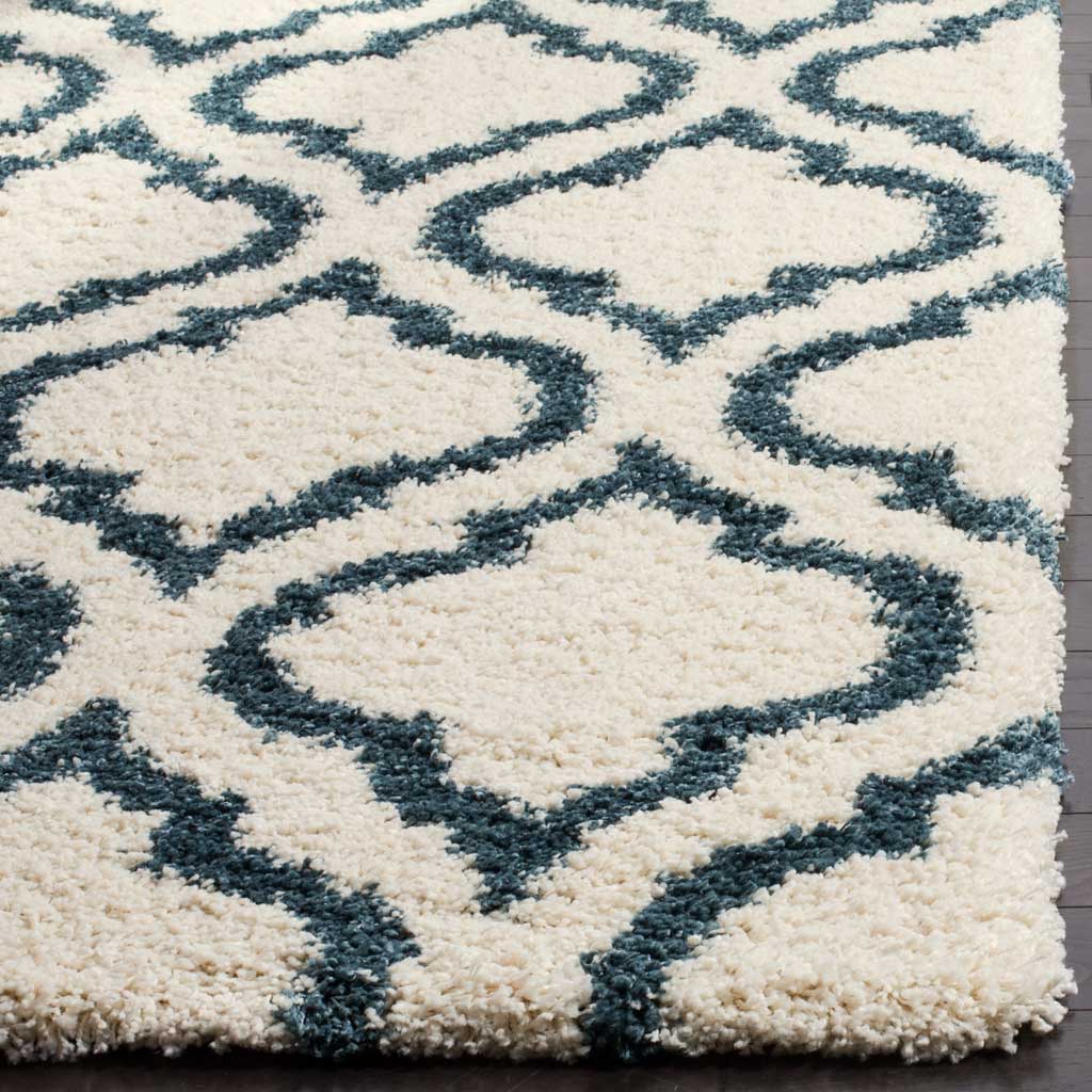 Dense ivory shag and steel blue outlines meet at a soft edge