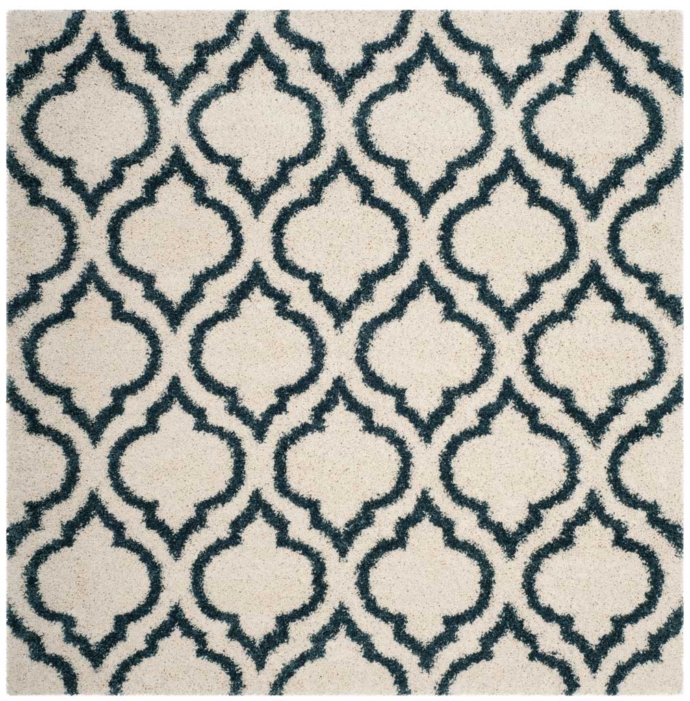 Square ivory rug with bold steel blue curved motifs