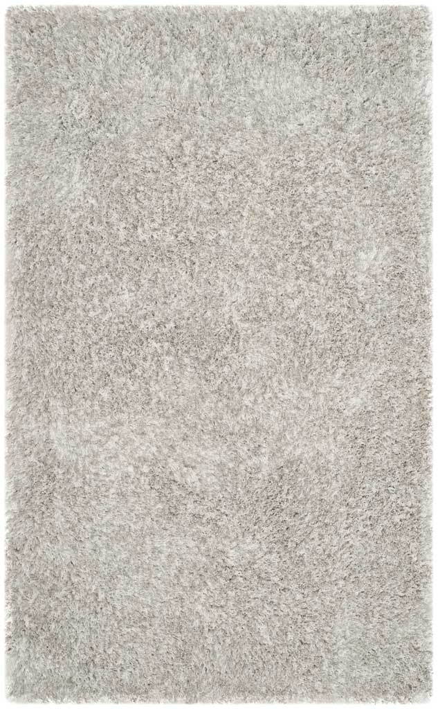 A smaller light gray rug features dense shag fibers and a soft, even texture