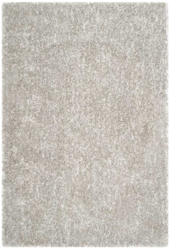 Pale gray polyester shag brings subtle texture and warmth to this rectangular rug