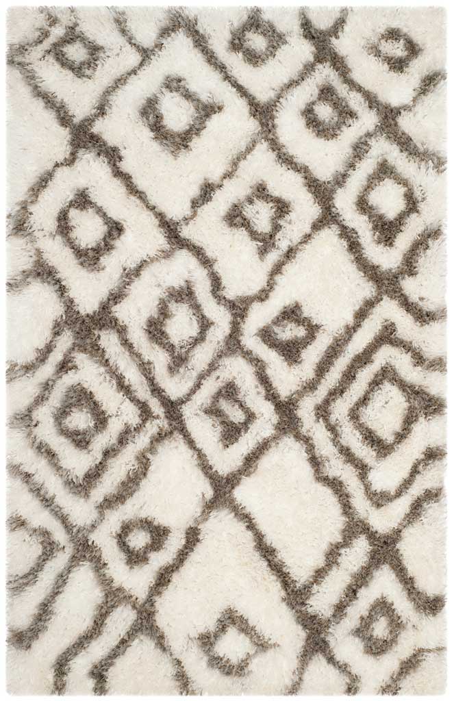 Small gray diamond motifs punctuate the soft ivory pile of this rectangular rug