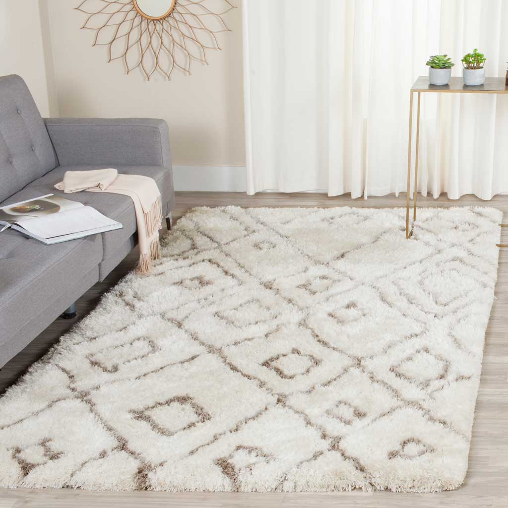 An ivory shag rug with light gray diamonds softens a bright seating area