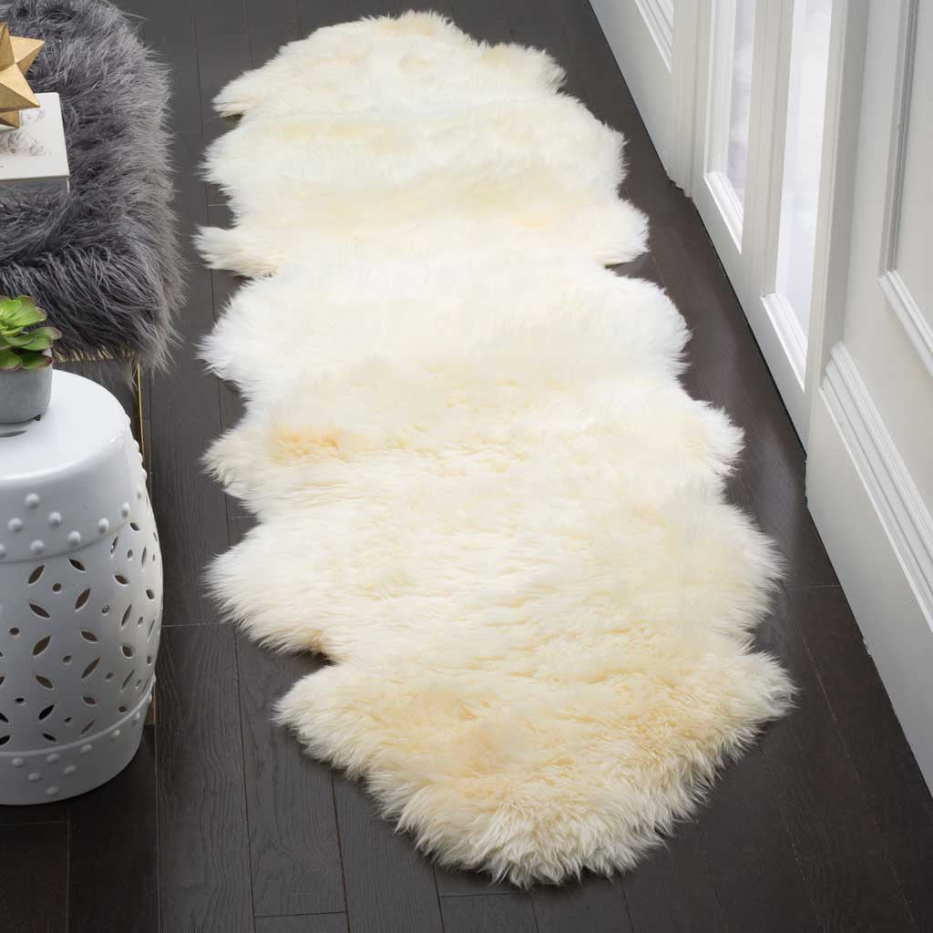 Long, plush ivory sheepskin runner brings warmth to a narrow floor space