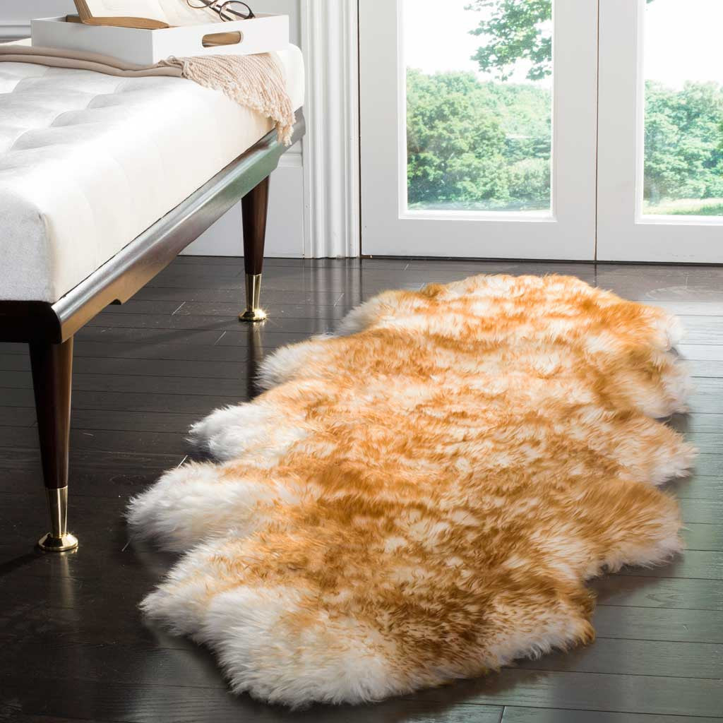 Brown-tipped, off-white sheepskin offers inviting softness on dark hardwood