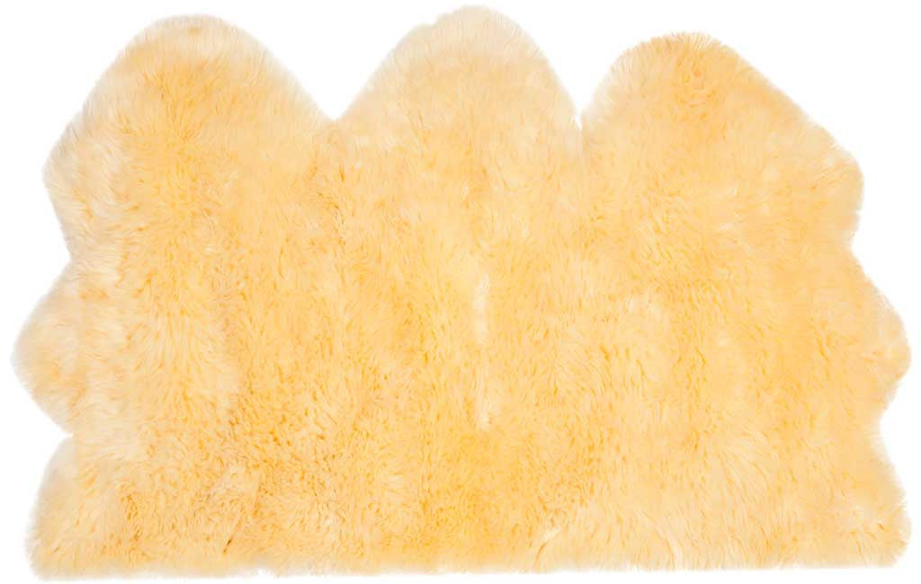 Three plush champagne sheepskin panels create a softly curved, inviting rug.