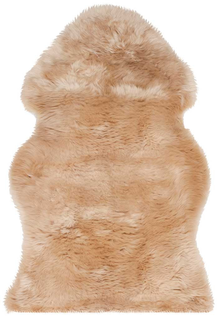 A single beige sheepskin adds natural color and a thick, gently rippled pile.