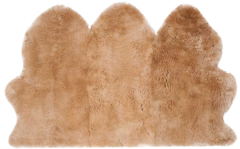 Three joined sheepskin sections display velvety beige fleece and softly rounded contours.