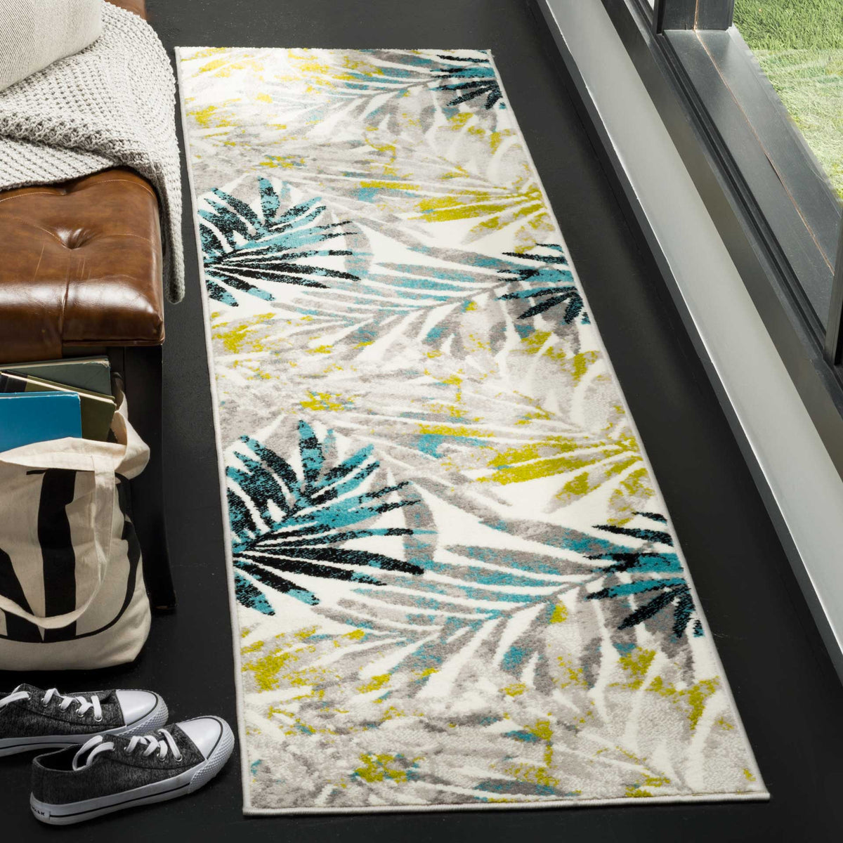 Bold palm leaves in teal and charcoal bring vibrant contrast to a runner with sunny yellow accents