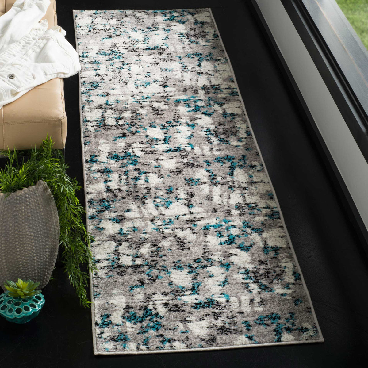 Blue accents weave through a softly distressed gray runner for bold, modern color