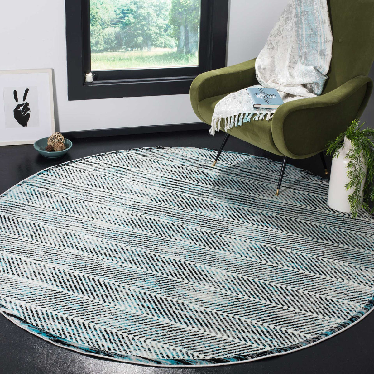 Gray and blue herringbone rug brings graphic texture to a cozy seating area