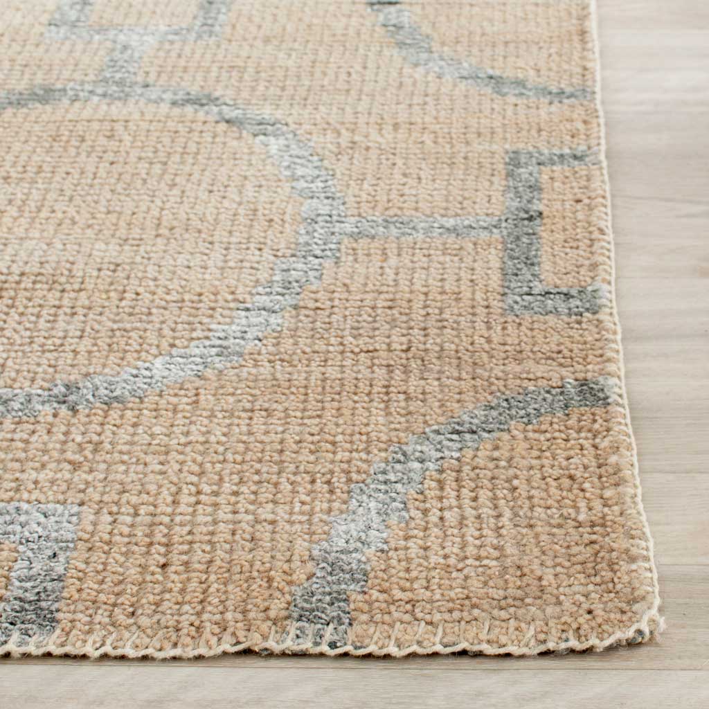 Raised gray circular outlines cross a textured beige pile with neatly bound edges