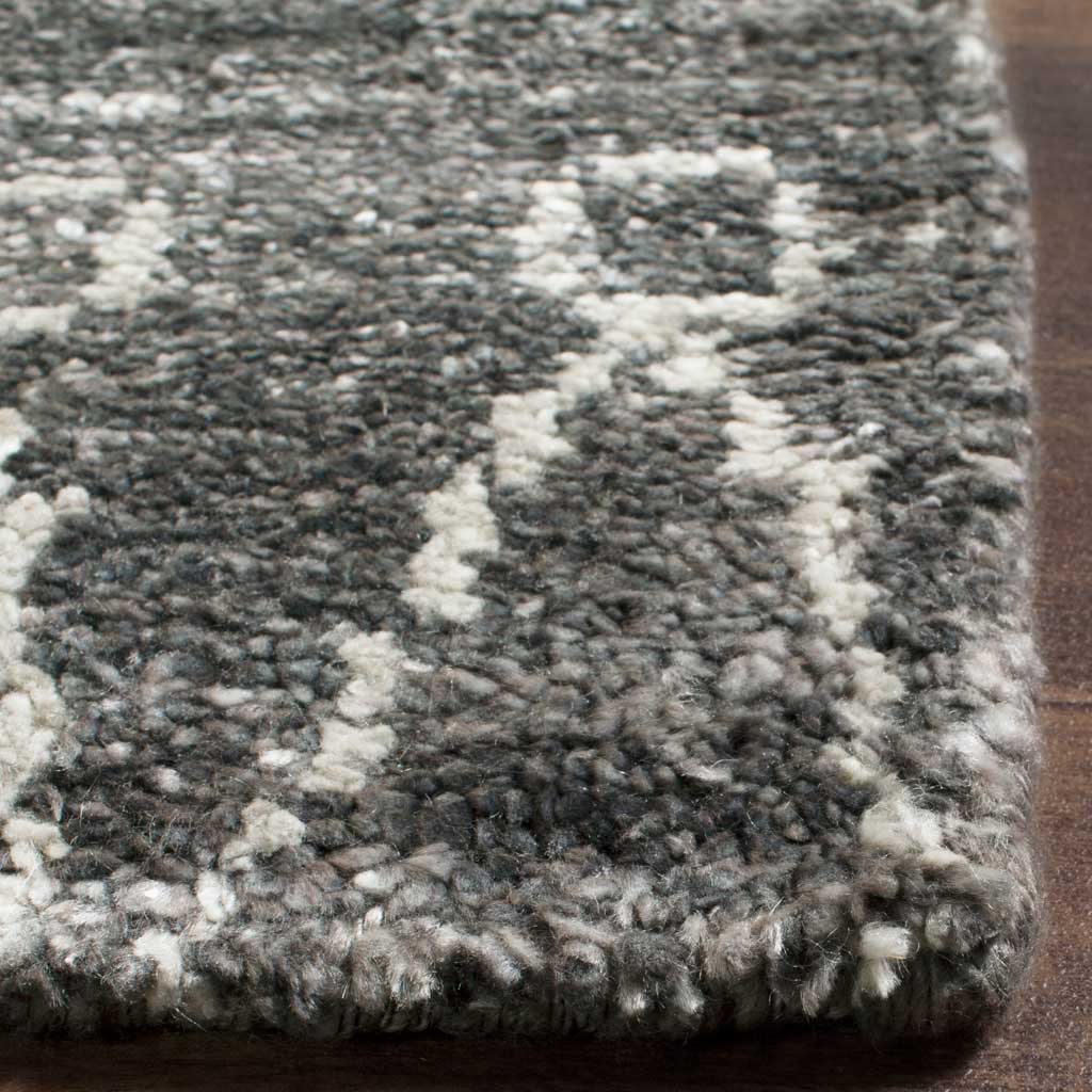 Chunky gray fibers and raised ivory lines meet at a thick, finished corner