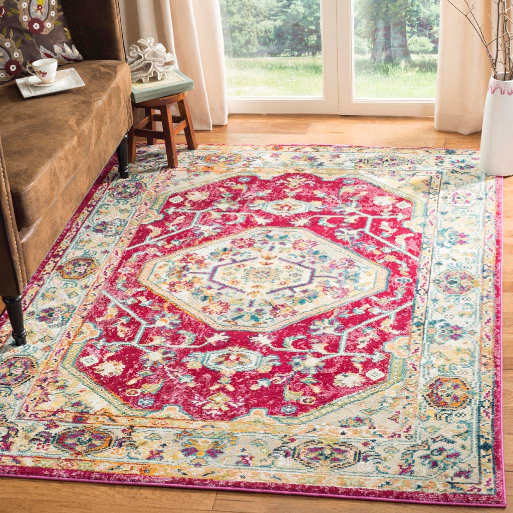 A floral medallion rug brightens a sunlit living room with vivid fuchsia and cream tones