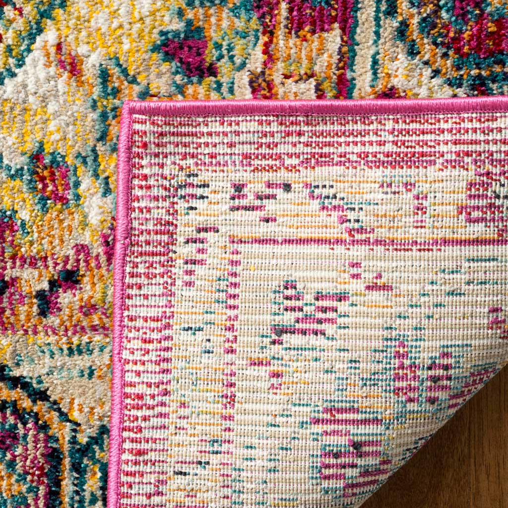Woven cotton backing and a neatly bound fuchsia edge finish this colorful rug