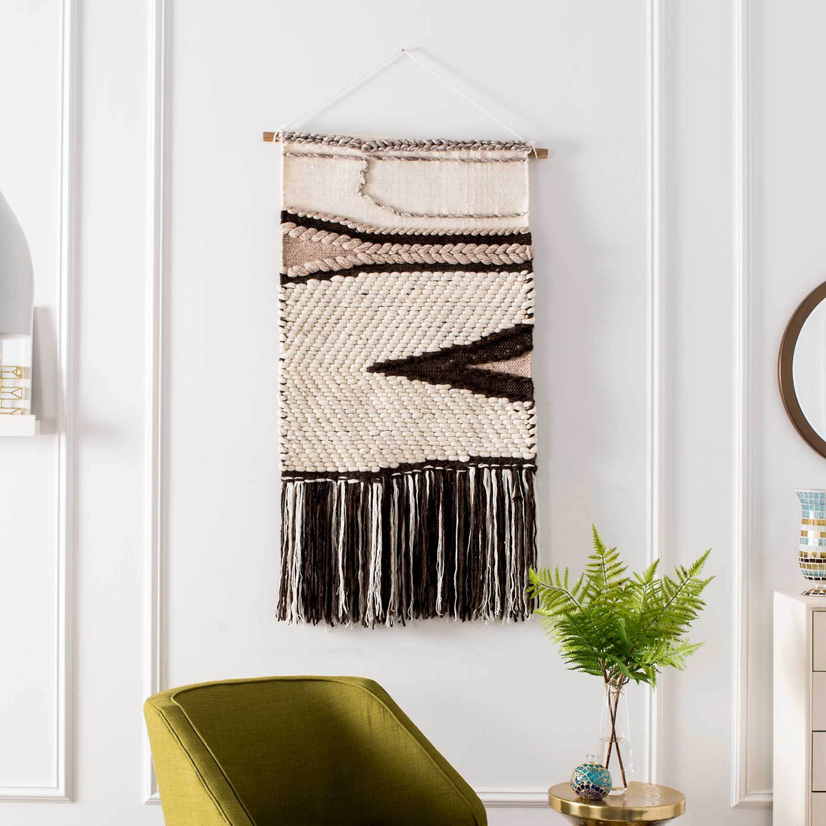 Graphic brown zigzags and dark tassel fringe bring striking contrast to this neutral wall tapestry.