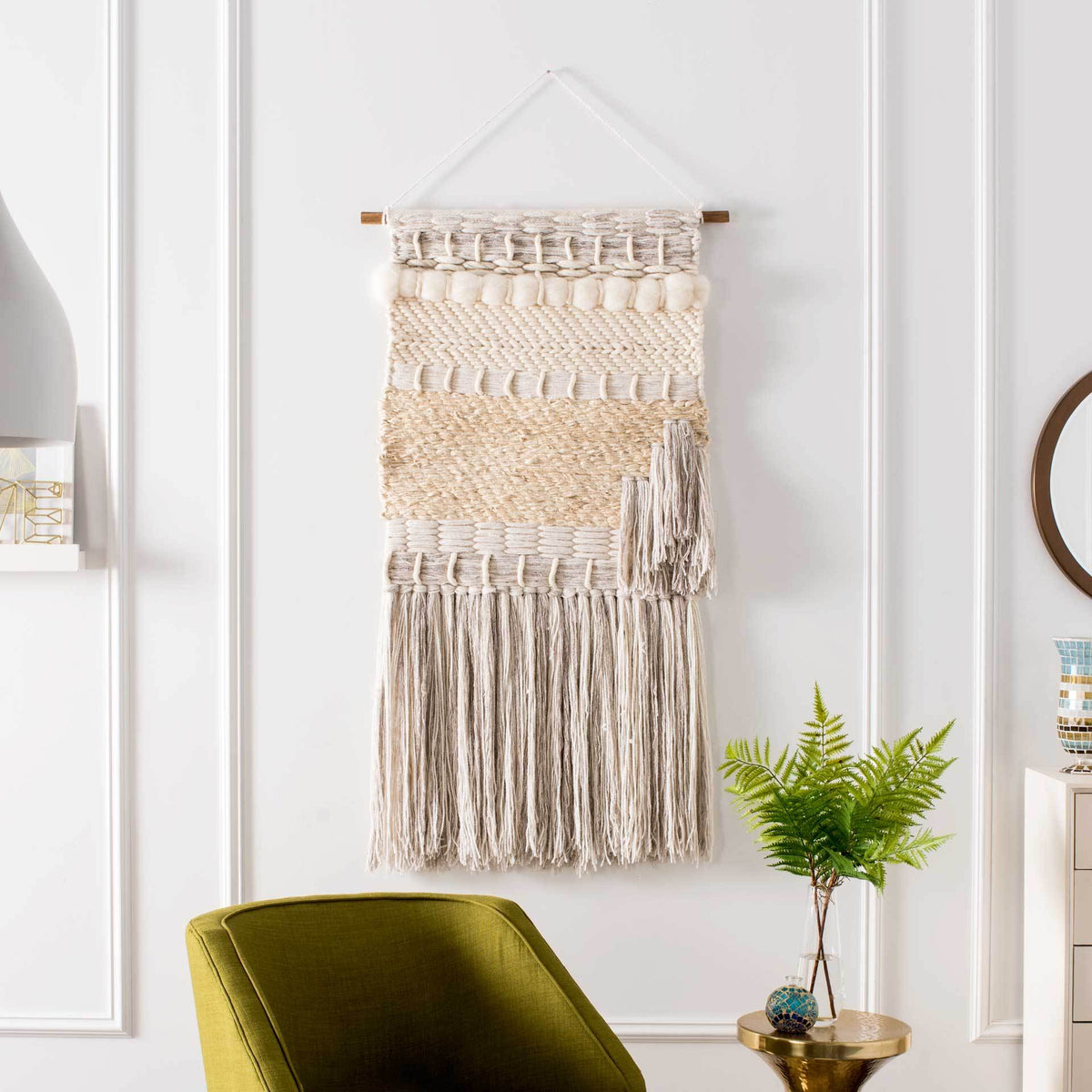 A cream-and-natural woven tapestry adds warmth with raised loops, an offset tassel, and full-length fringe.