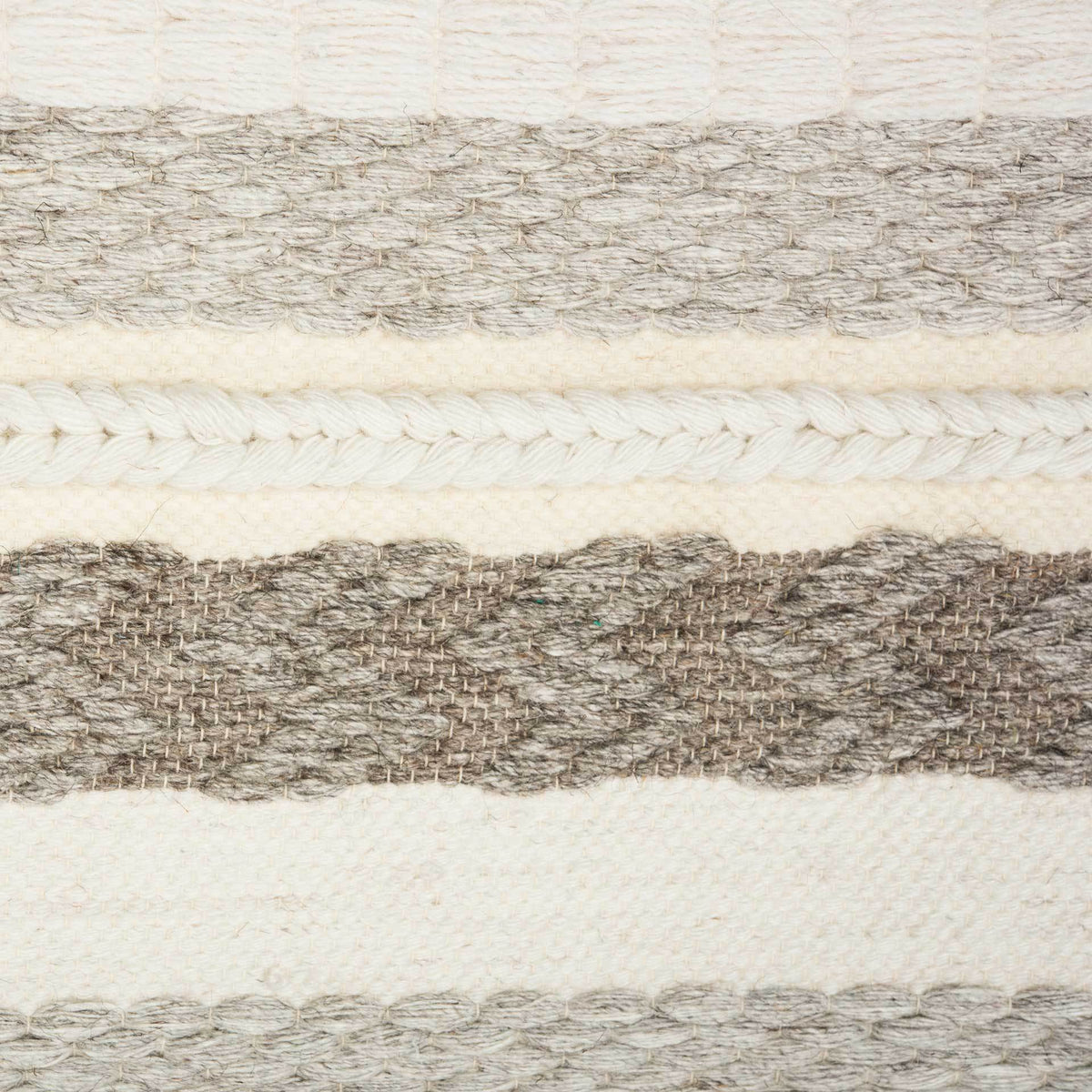 Soft wool bands alternate with braided ivory rows and heathered gray textured stripes.