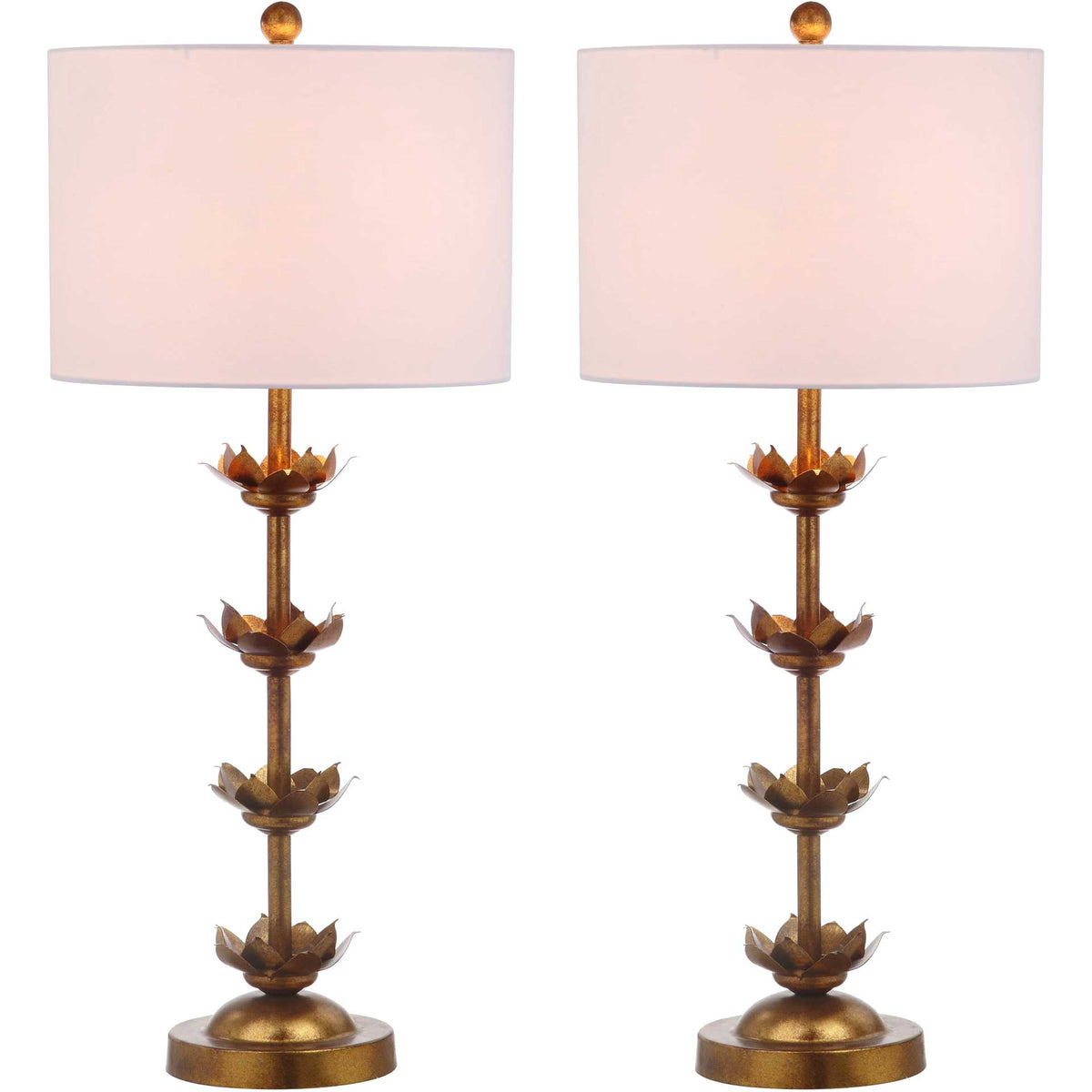 White drum shades cast a warm glow over the sculpted gold leaves on two matching lamps.