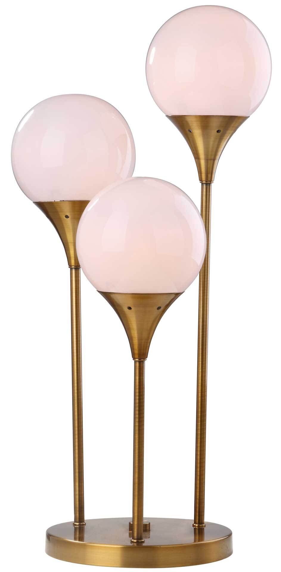 Three softly glowing globes add warmth to a sculptural brass-finished lamp