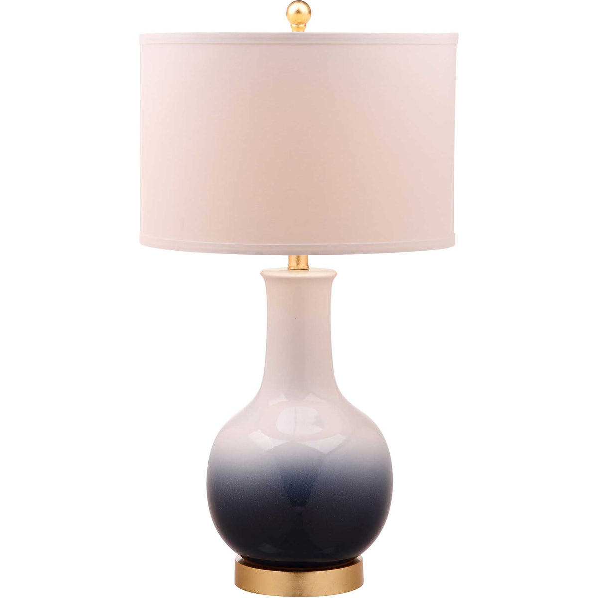 A softly glowing white drum shade tops an ombre ceramic base with a gold foot and finial