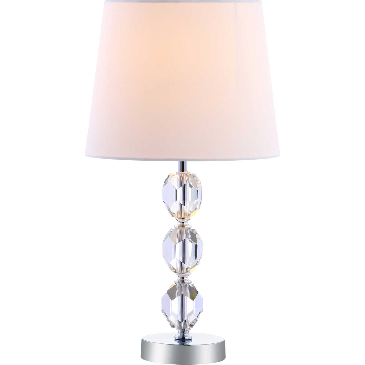 A softly glowing white shade warms the faceted crystal column and reflective chrome base