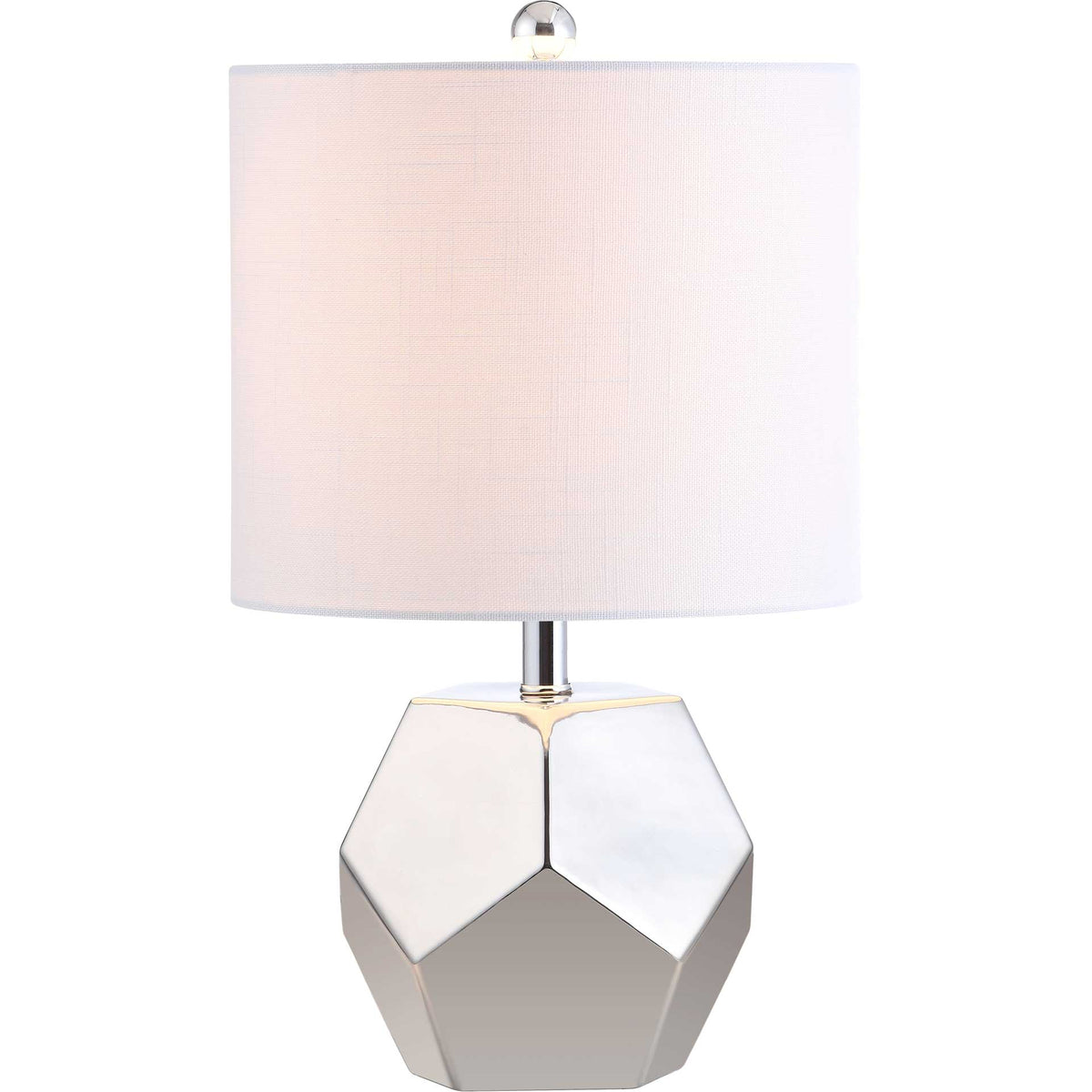 Warm light glows through the white shade above a reflective, geometric silver base