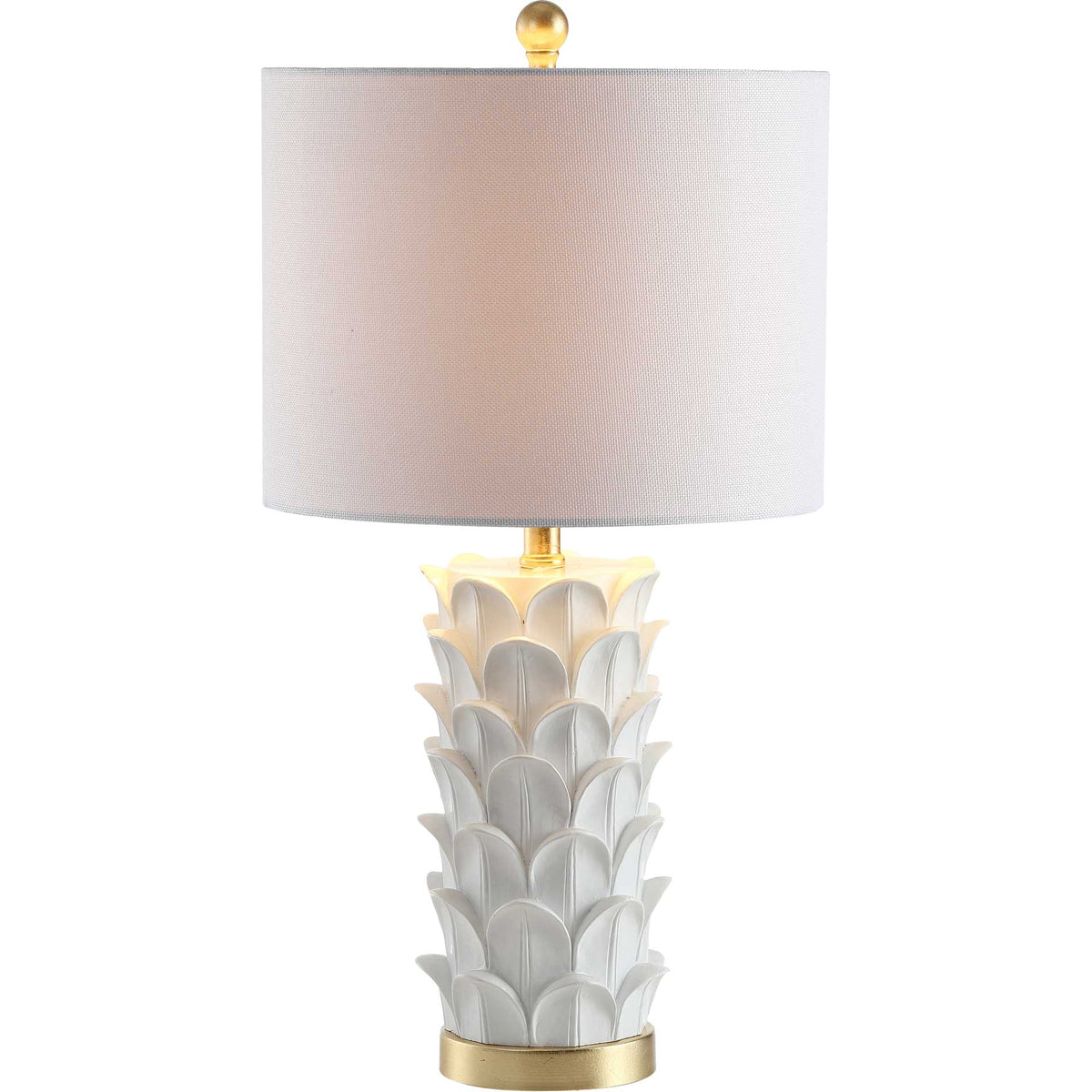 A warm glow softens the white drum shade above a sculpted leaf base and gold trim.