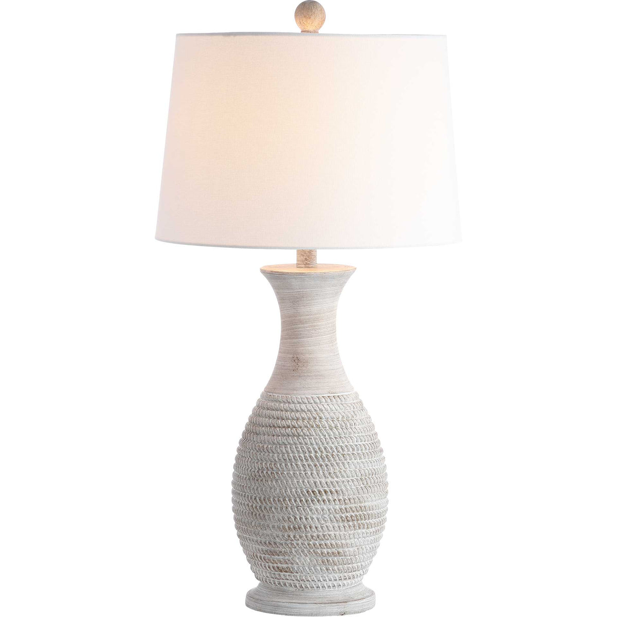 A softly glowing white shade tops a textured gray urn-shaped lamp base